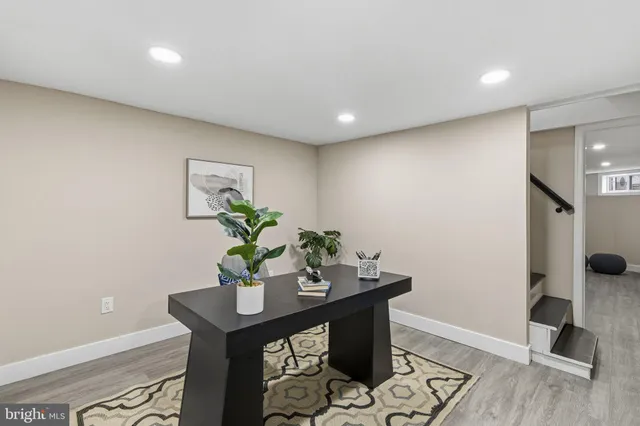 a workspace with furniture and wooden floor