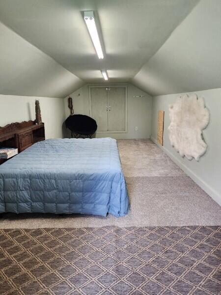 244 Riessen Road Grants Pass, OR 97526 - Photo 42 of 52 a bedroom with a large bed and a cabinets