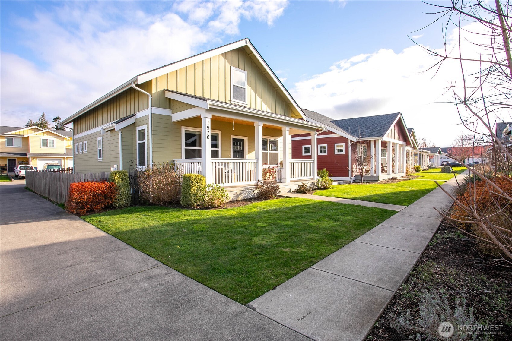 a front view of a house with a garden and porch