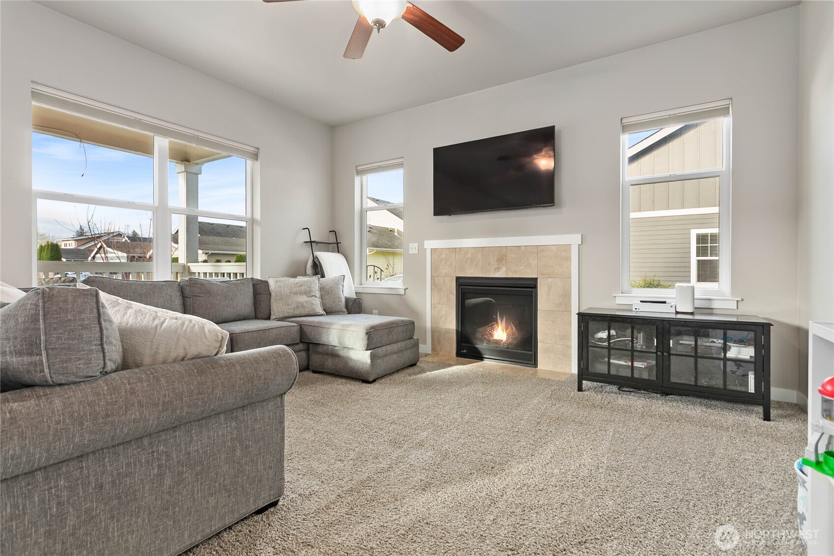 1970 North Prairie Lane Lynden, WA 98264 - Photo 13 of 40 a living room with furniture a fireplace and a flat screen tv
