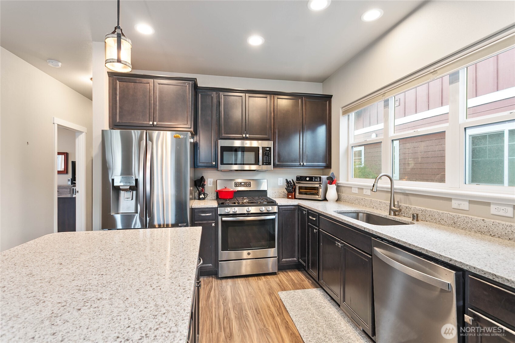 1970 North Prairie Lane Lynden, WA 98264 - Photo 18 of 40 a kitchen with stainless steel appliances granite countertop a sink stove and refrigerator