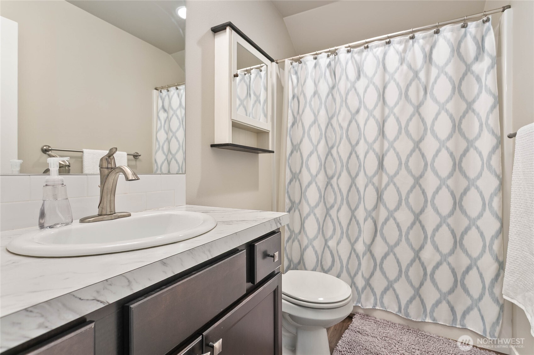 1970 North Prairie Lane Lynden, WA 98264 - Photo 29 of 40 a bathroom with a sink a toilet and a mirror