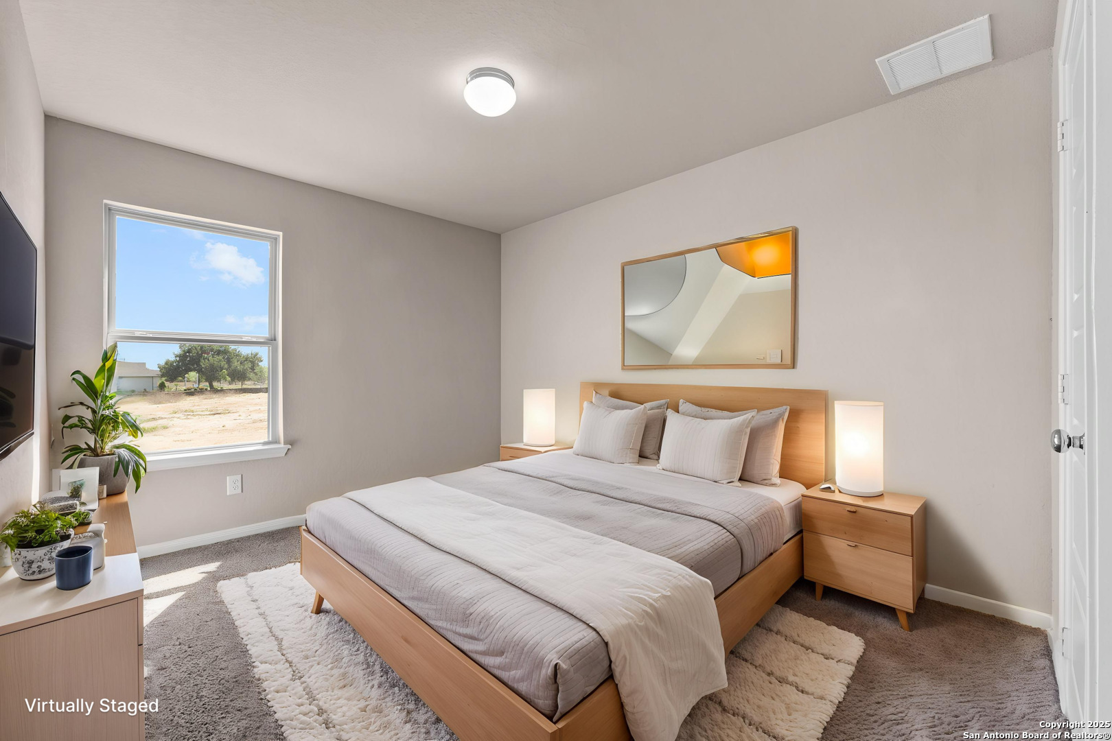 1108 Limestone Ridge Seguin, TX 78155 - Photo 8 of 17 a bedroom with a bed and a painting on the wall