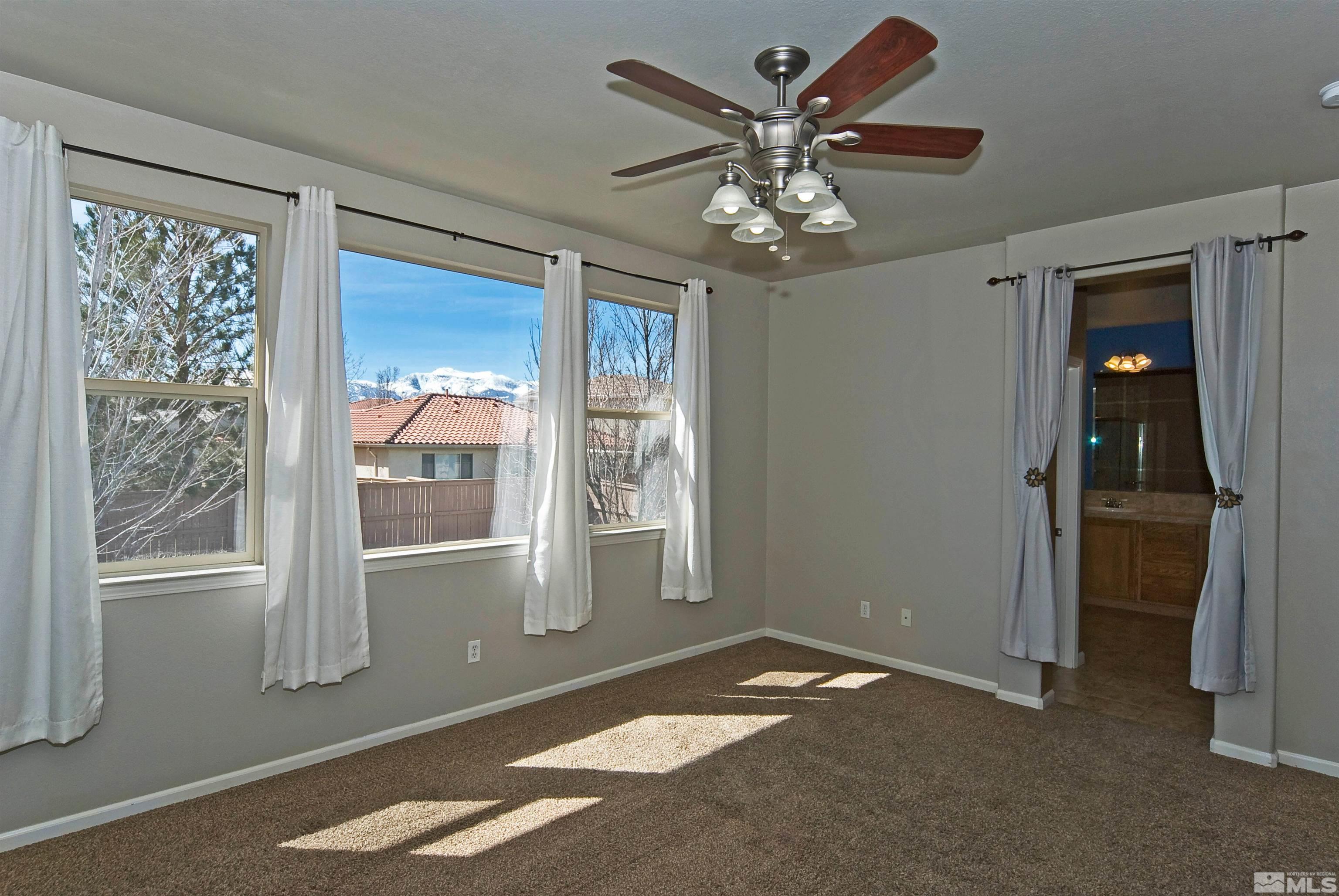 10620 Fire Poppy Circle Reno, NV 89521 - Photo 13 of 25 a view of an empty room with a window