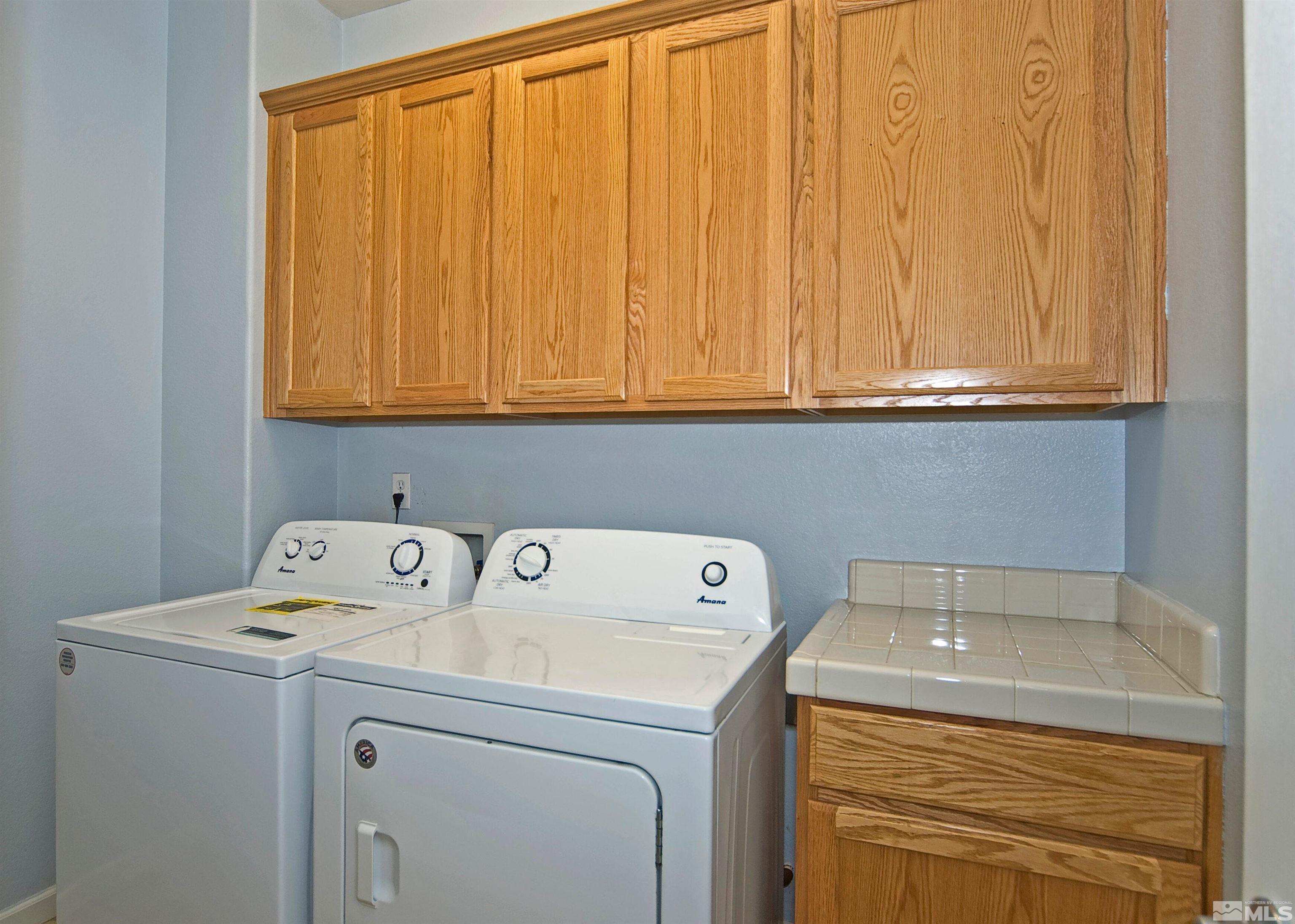 10620 Fire Poppy Circle Reno, NV 89521 - Photo 18 of 25 a utility room with dryer and washer