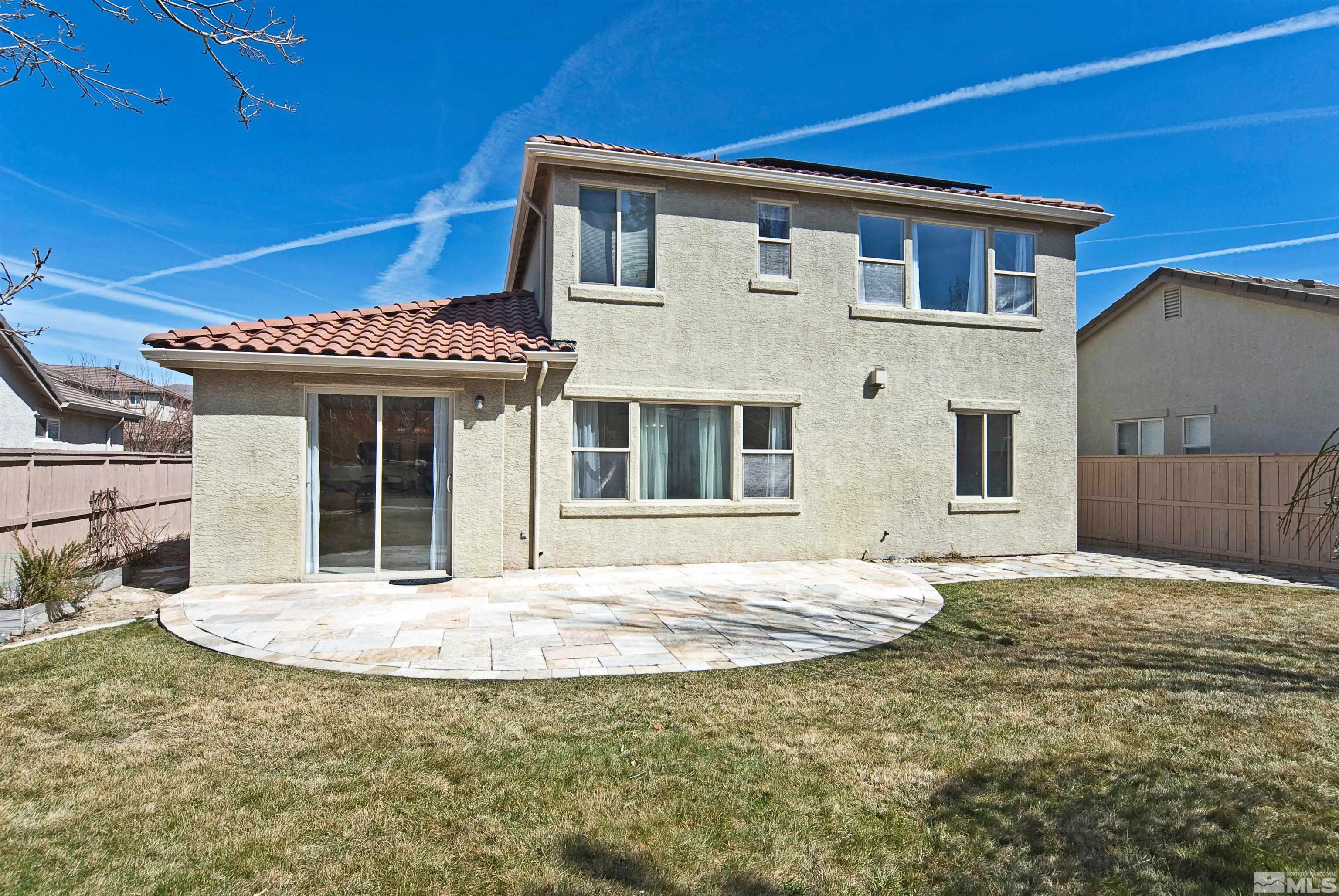 10620 Fire Poppy Circle Reno, NV 89521 - Photo 23 of 25 a front view of a house with a garden