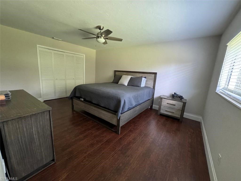 857 Palm View Drive, Unit 32 Naples, FL 34110 - Photo 5 of 9 a bedroom with a bed and a window