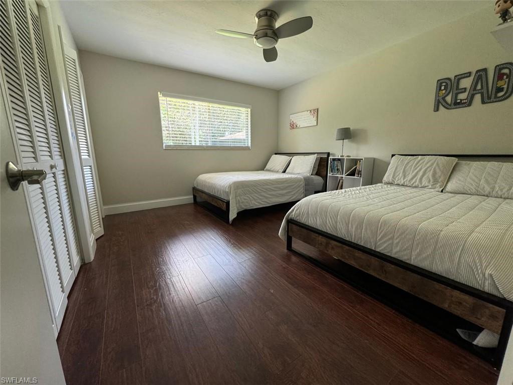 857 Palm View Drive, Unit 32 Naples, FL 34110 - Photo 7 of 9 a bedroom with double bed and a window