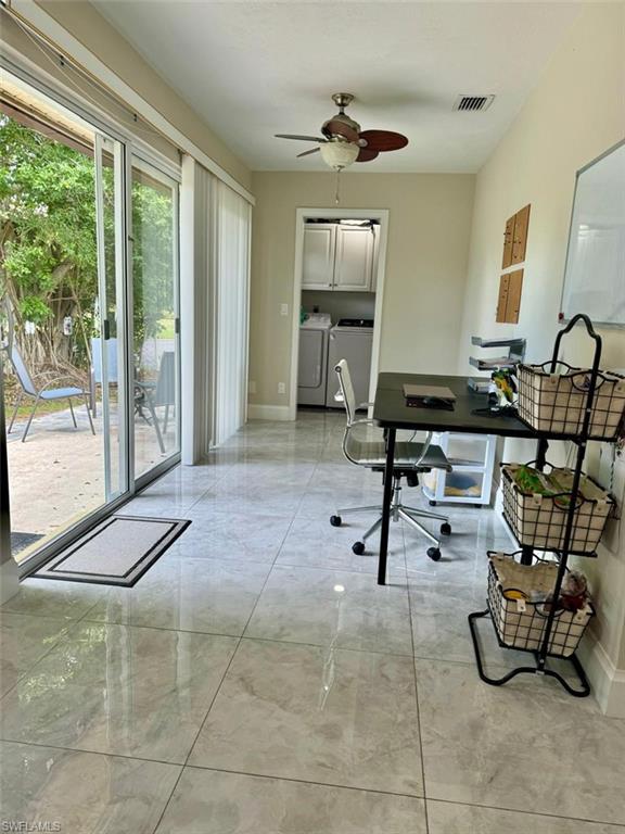 857 Palm View Drive, Unit 32 Naples, FL 34110 - Photo 8 of 9 a room with lots of furniture and a glass door shower