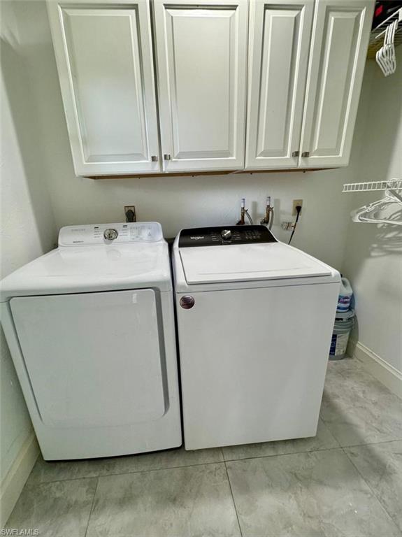 857 Palm View Drive, Unit 32 Naples, FL 34110 - Photo 9 of 9 a utility room with dryer and washer