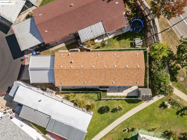an aerial view of a house with swimming pool