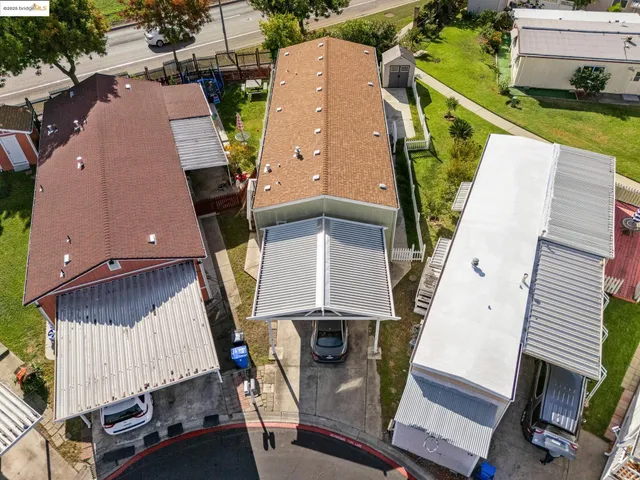 an aerial view of a house with a patio