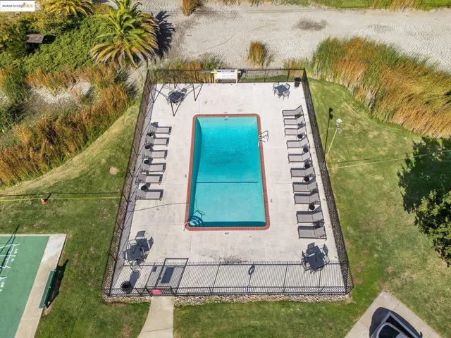 a view of swimming pool with a yard