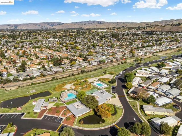 an aerial view of residential houses with outdoor space