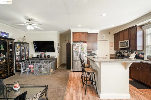 a living room with furniture a lamp and a window