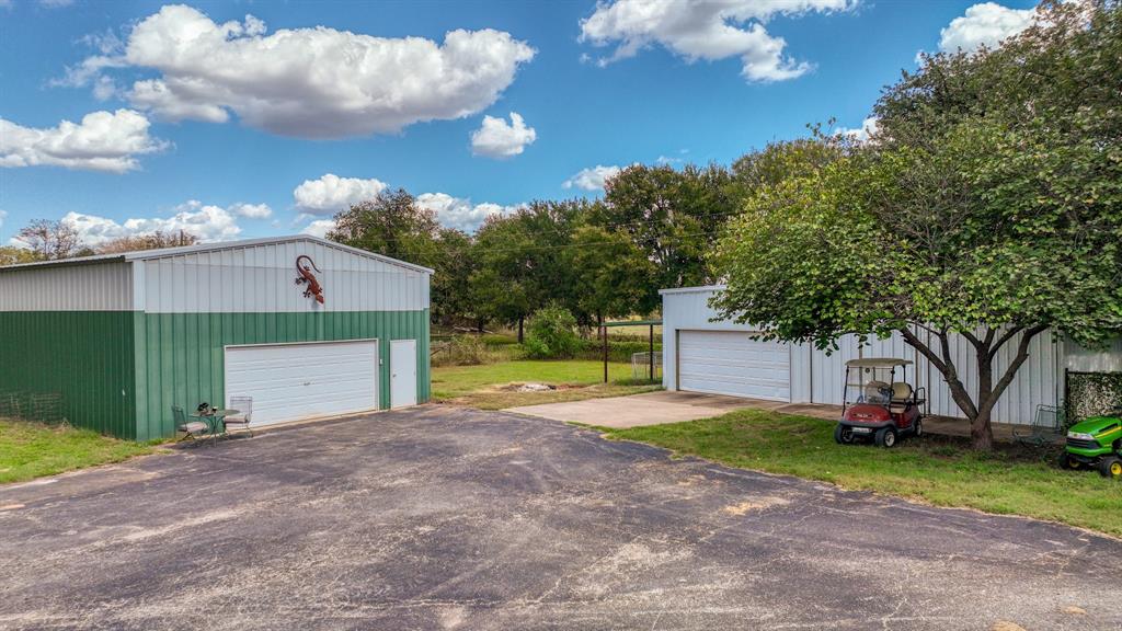1240 Riverview Road Millsap, TX 76066 - Photo 9 of 36 a view of a house with entertaining space and a big yard