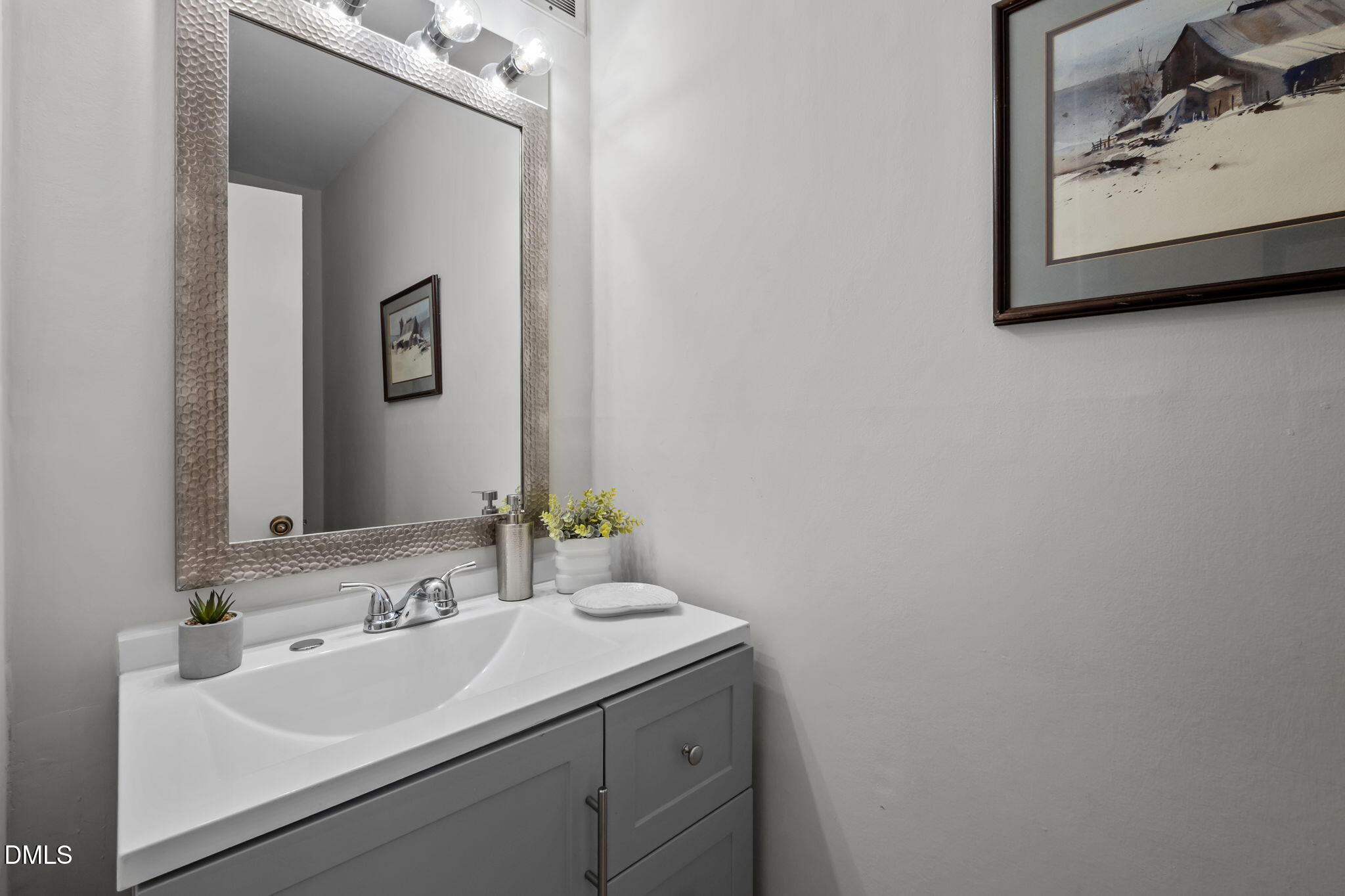 3080 Colony Road, Unit 3080C Durham, NC 27705 - Photo 18 of 57 a bathroom with a sink and a mirror