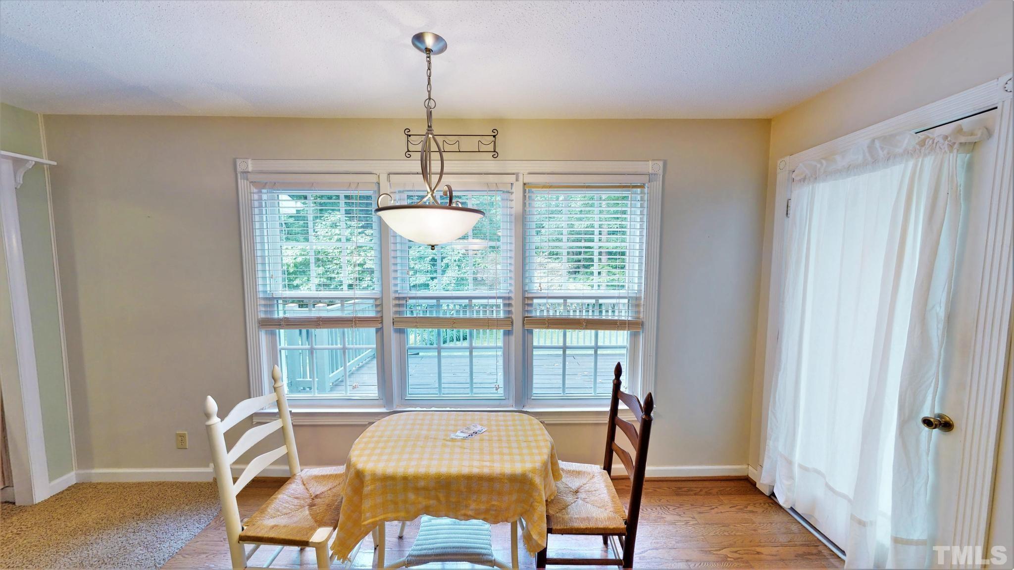 1496 Kerner Road Kernersville, NC 27284 - Photo 18 of 82 a view of a dining room with furniture window and wooden floor