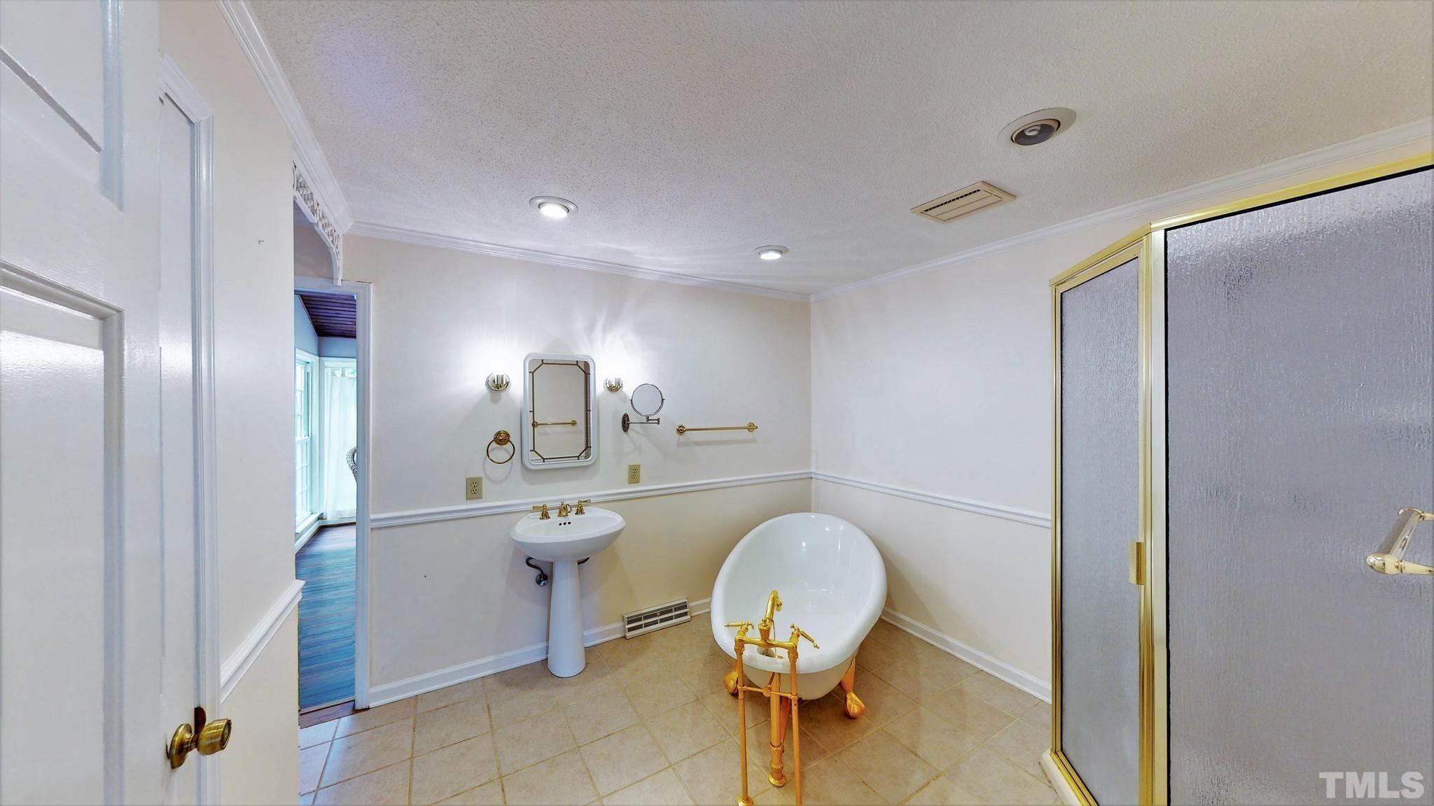 1496 Kerner Road Kernersville, NC 27284 - Photo 26 of 82 a spacious bathroom with a toilet a sink and a mirror