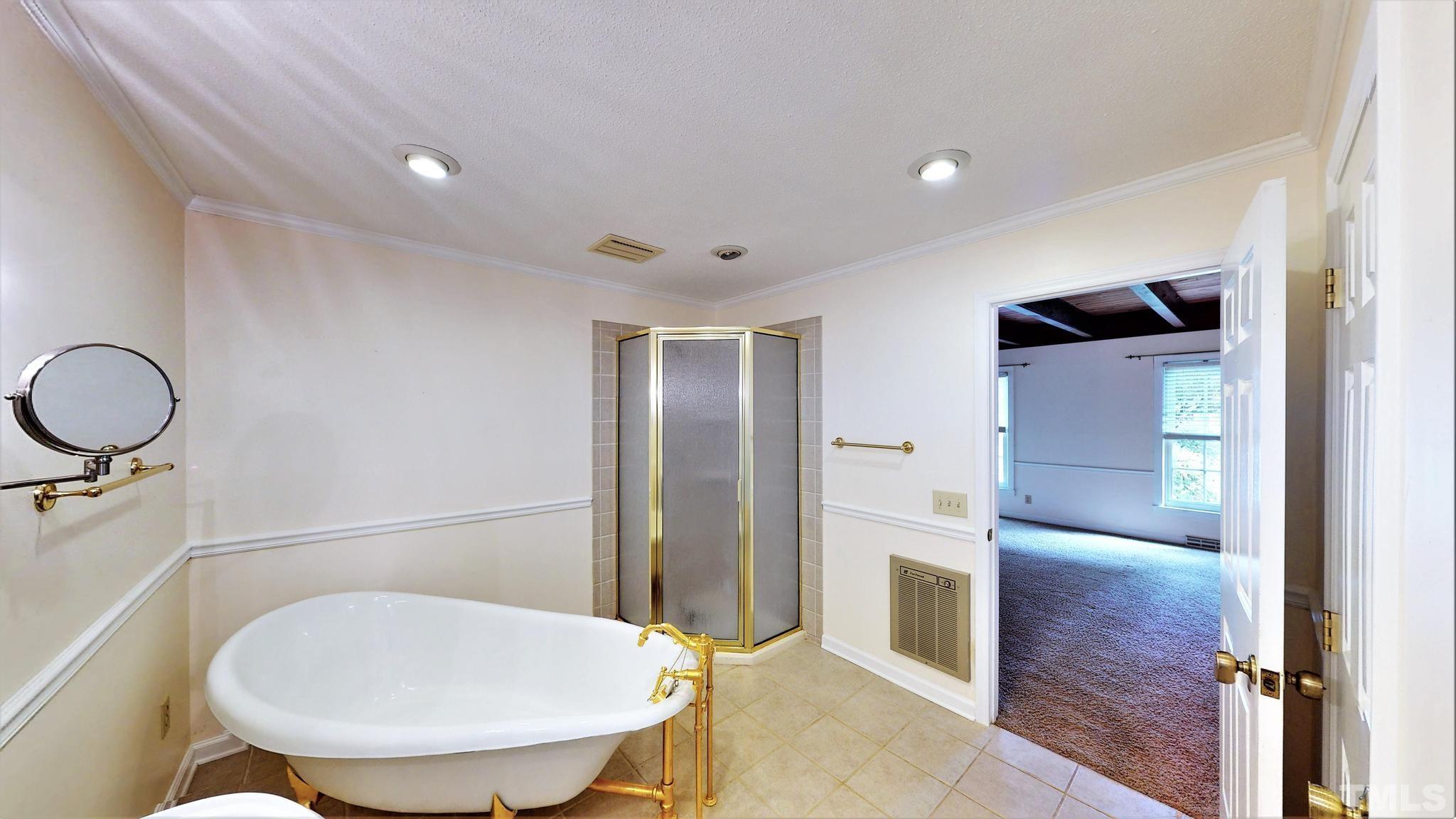 1496 Kerner Road Kernersville, NC 27284 - Photo 27 of 82 a bathroom with a mirror and a toilet