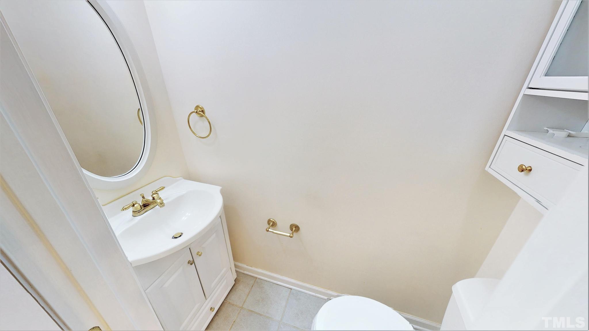 1496 Kerner Road Kernersville, NC 27284 - Photo 29 of 82 a bathroom with a sink a toilet and a mirror