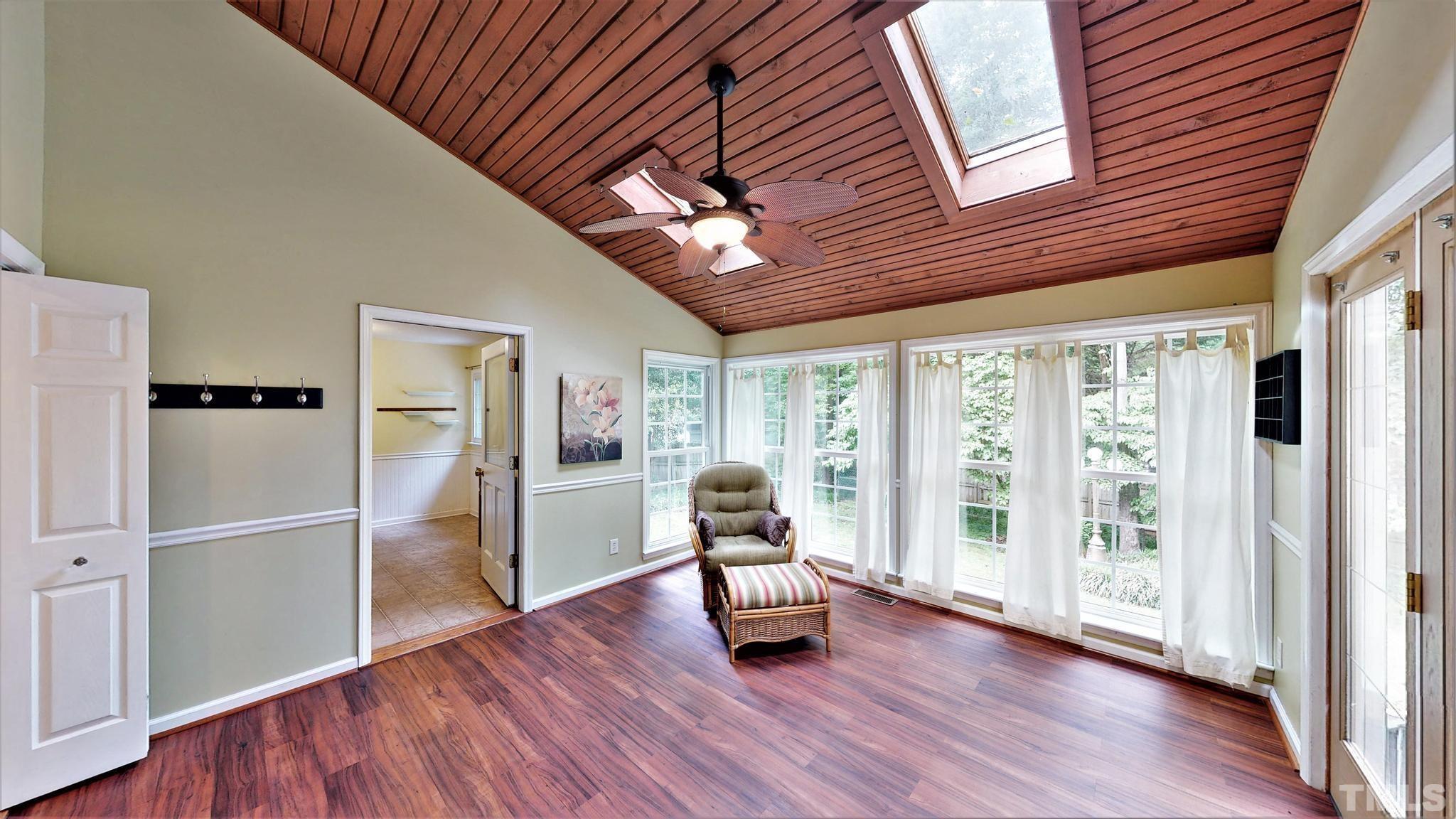 1496 Kerner Road Kernersville, NC 27284 - Photo 31 of 82 a hallway with wooden floor and chandelier