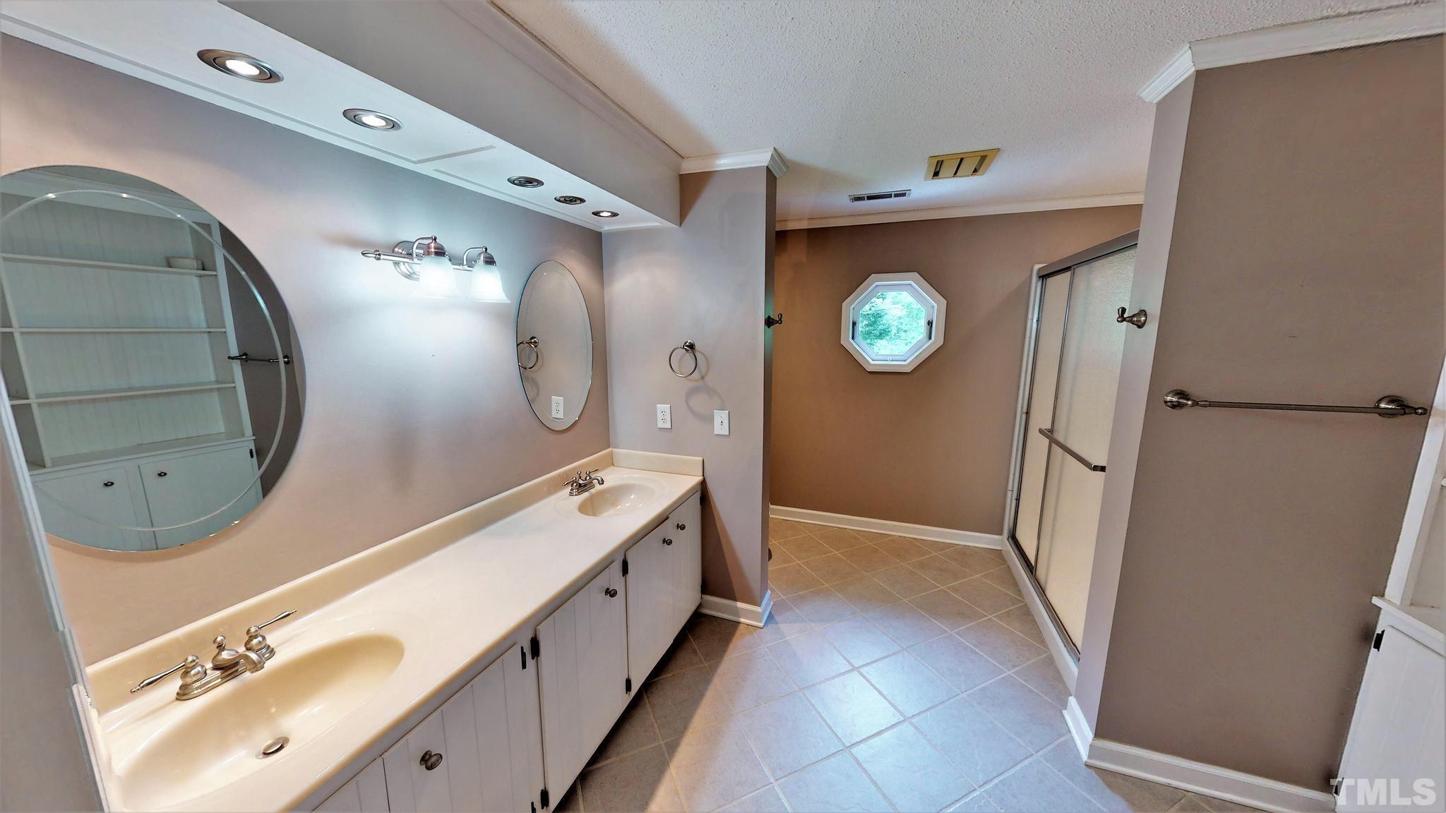 1496 Kerner Road Kernersville, NC 27284 - Photo 42 of 82 a bathroom with a bathtub sink and mirror