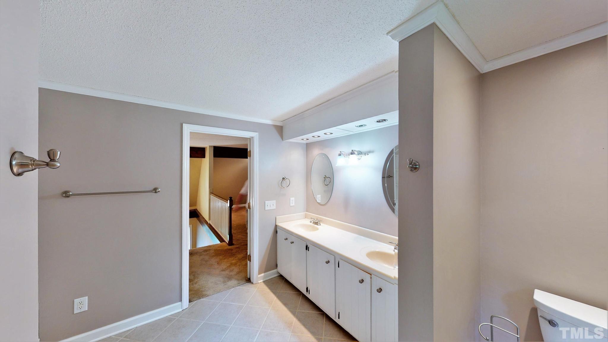 1496 Kerner Road Kernersville, NC 27284 - Photo 43 of 82 a spacious bathroom with a granite countertop sink and a mirror