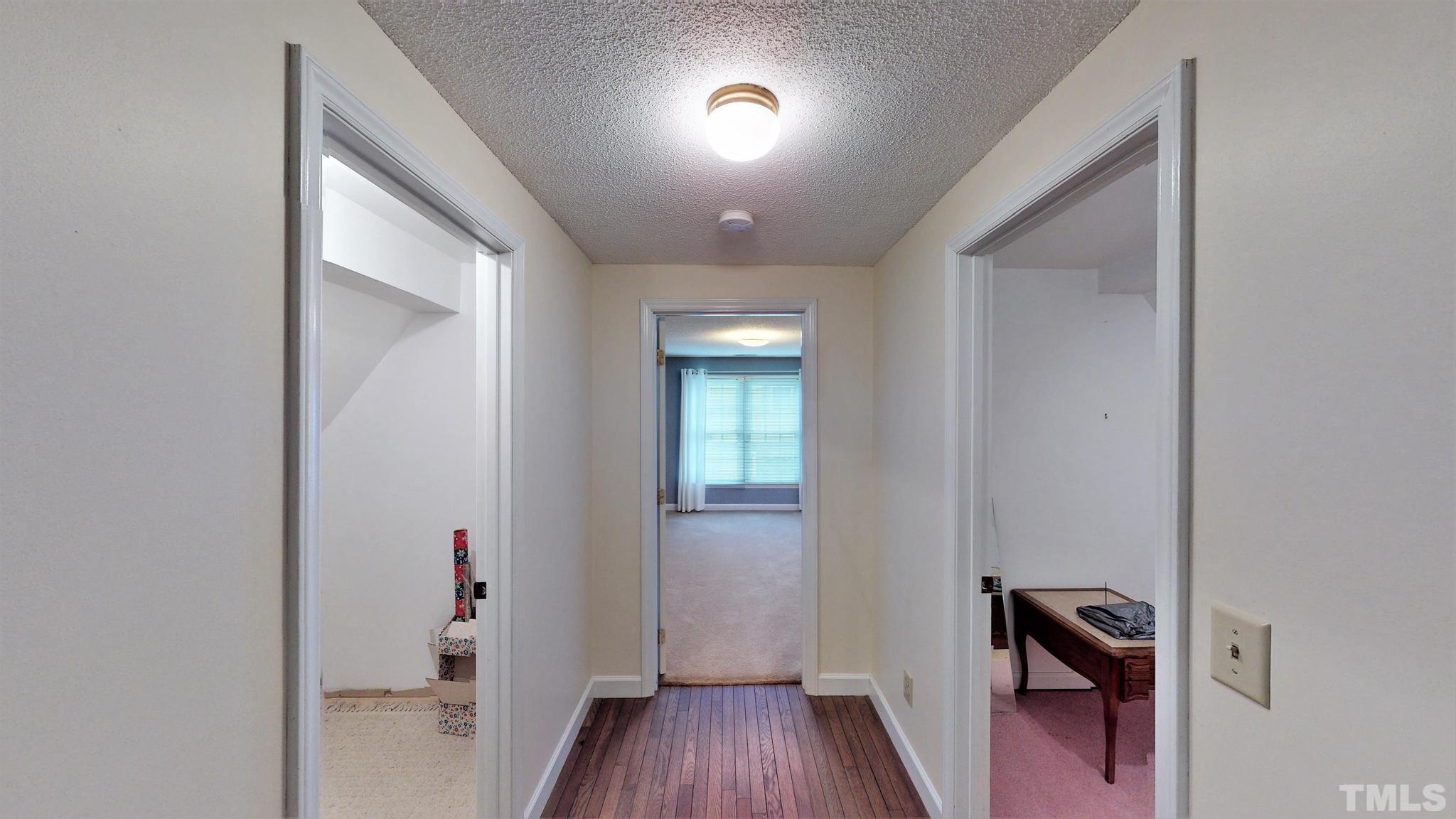 1496 Kerner Road Kernersville, NC 27284 - Photo 52 of 82 a view of a hallway and wooden floor with a bathroom