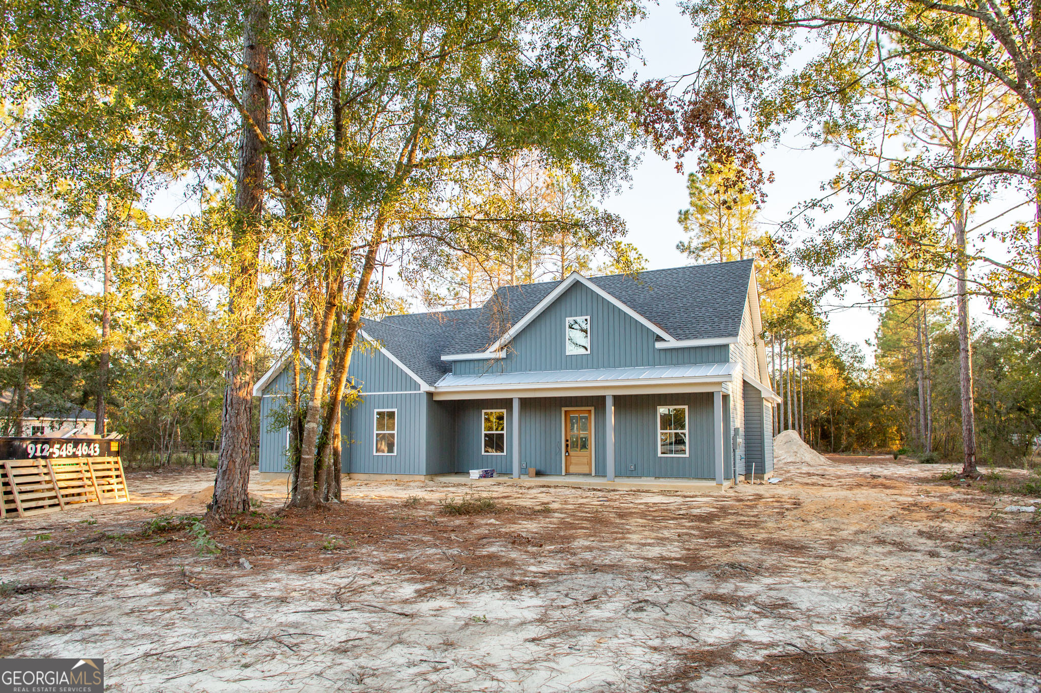 front view of a house with a yard