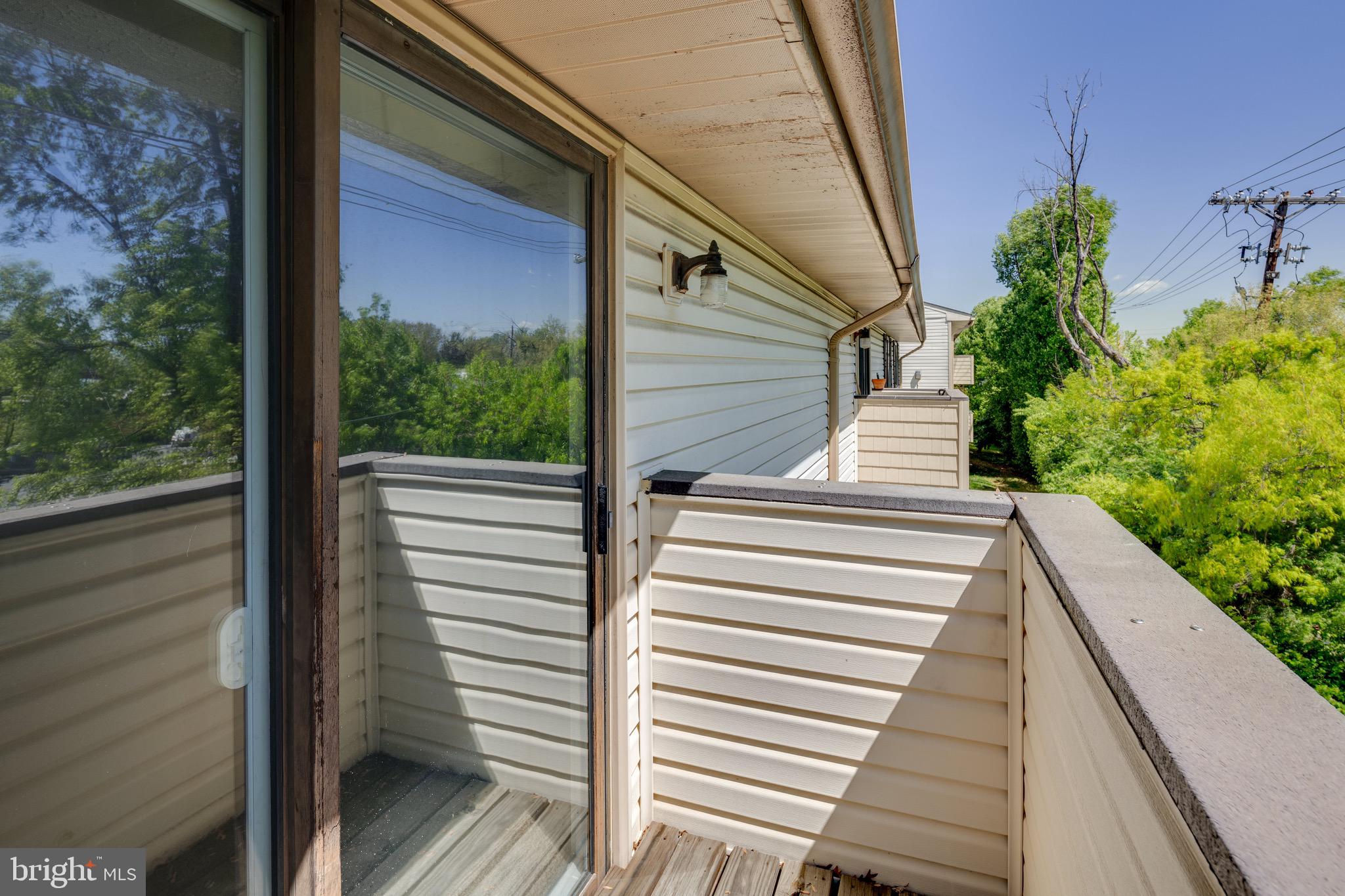19509 Gunners Branch Road, Unit 633 Germantown, MD 20876 - Photo 26 of 32 Balcony backs to trees