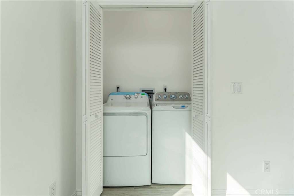 12615 George Street Garden Grove, CA 92840 - Photo 11 of 24 a utility room with dryer and washer