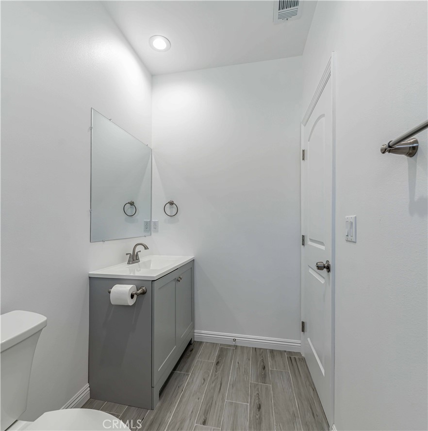 12615 George Street Garden Grove, CA 92840 - Photo 14 of 24 a bathroom with a sink toilet and shower
