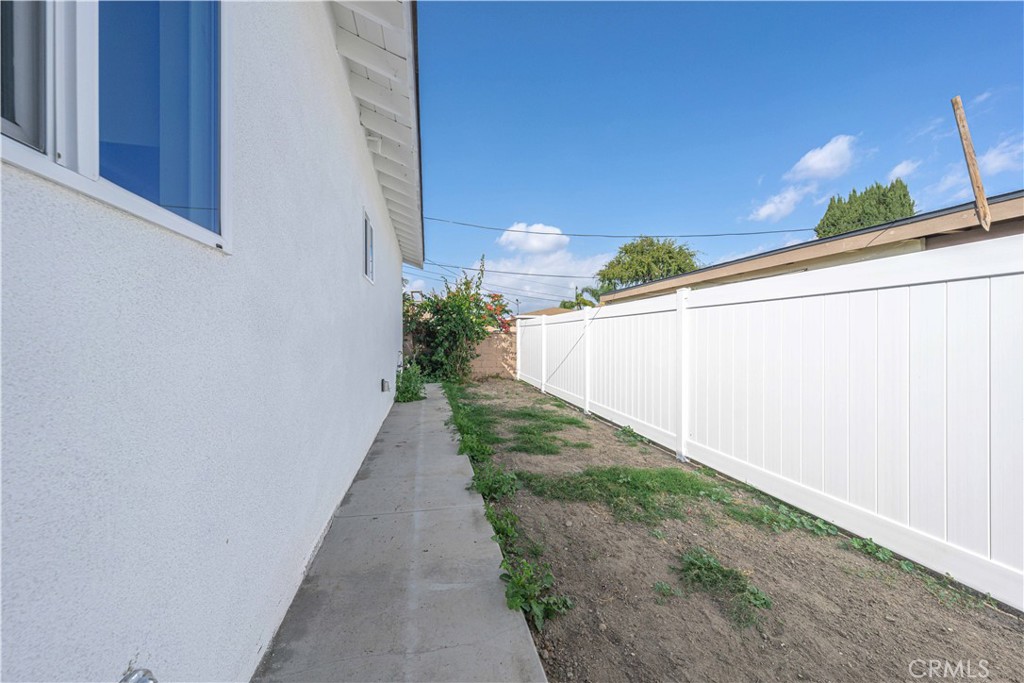 12615 George Street Garden Grove, CA 92840 - Photo 22 of 24 a view of a backyard with potted plants