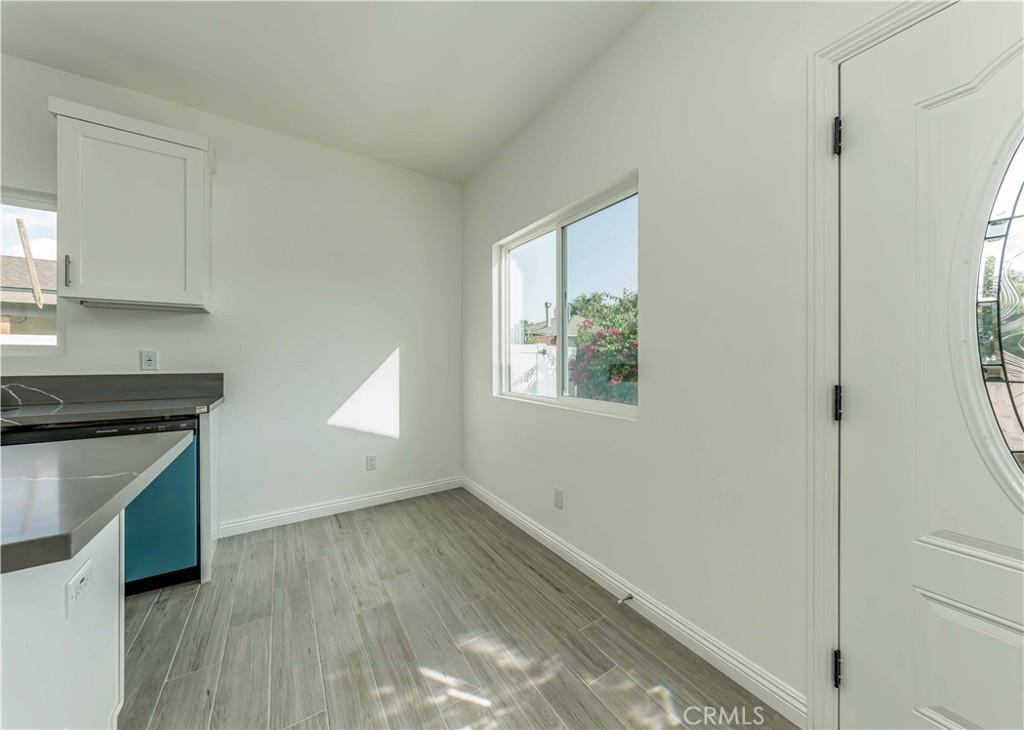 12615 George Street Garden Grove, CA 92840 - Photo 5 of 24 a view of empty room with wooden floor and fan