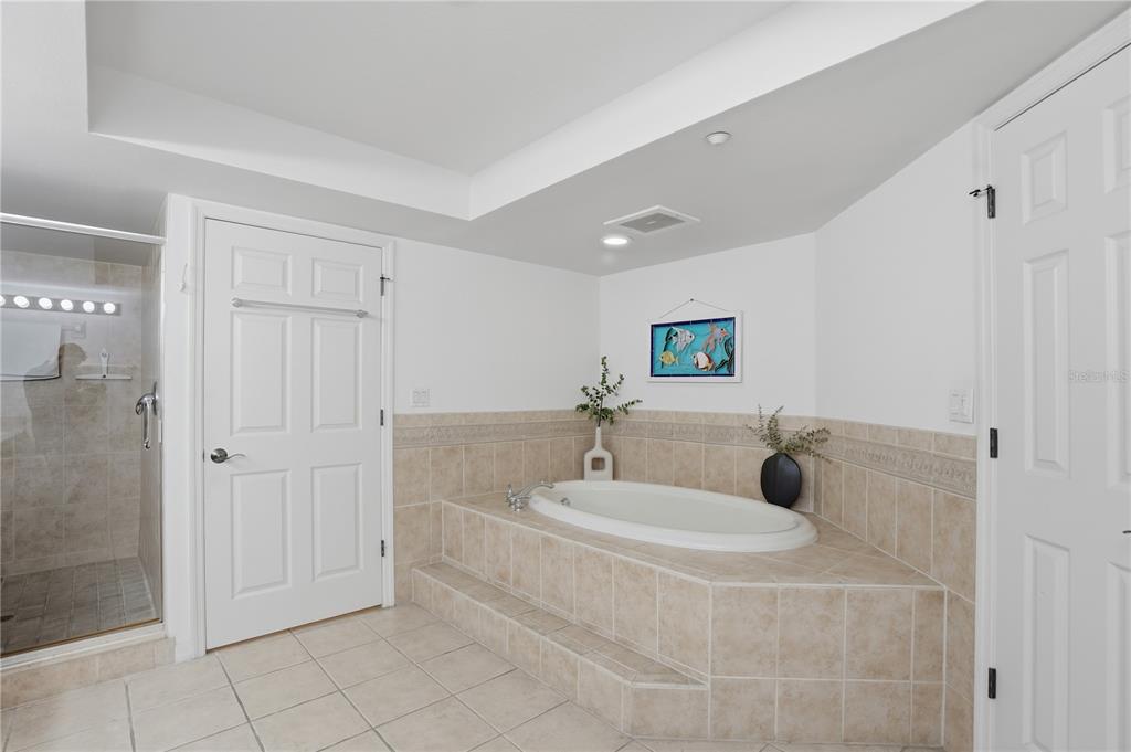 16326 Gulf Boulevard, Unit 307 Redington Beach, FL 33708 - Photo 19 of 43 a bathroom with a tub and a sink