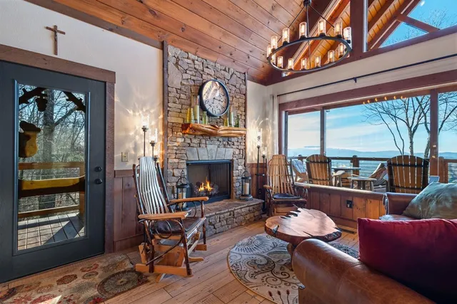 a living room with furniture ceiling fan and a fireplace