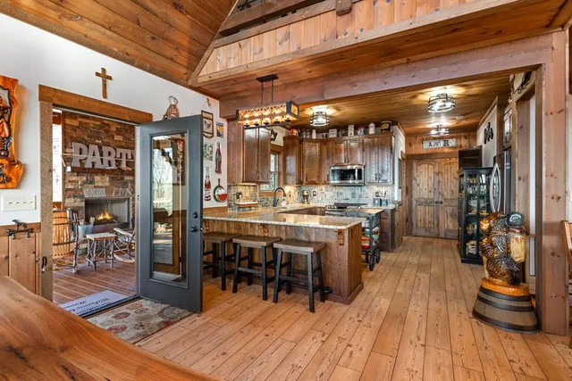 a living room with fireplace furniture and a window