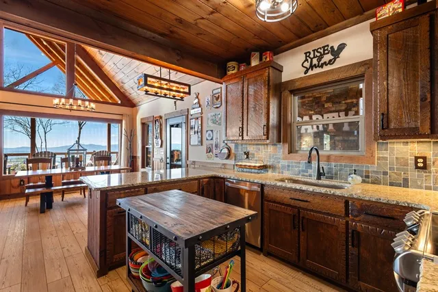 a bedroom with a bed a dresser and large mirror