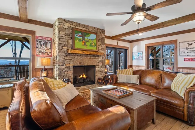 a view of a balcony with chairs and wooden floor