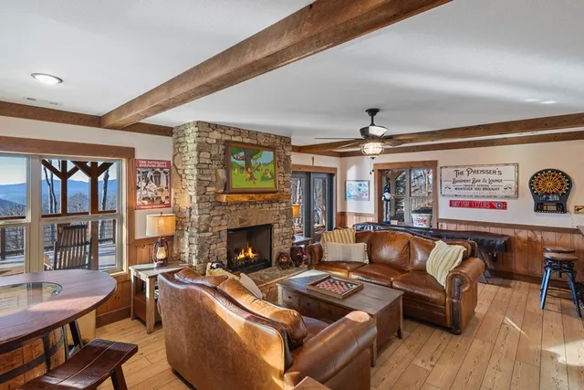 a view of a back yard of the house with a seating space