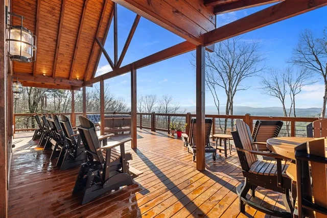 a bedroom with a large bed and a large window