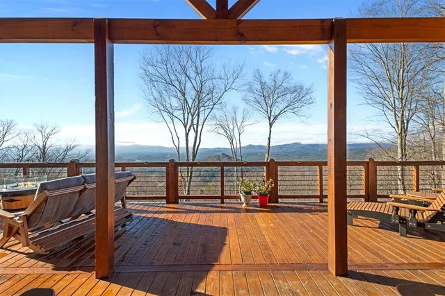 a living room with furniture a rug and a window