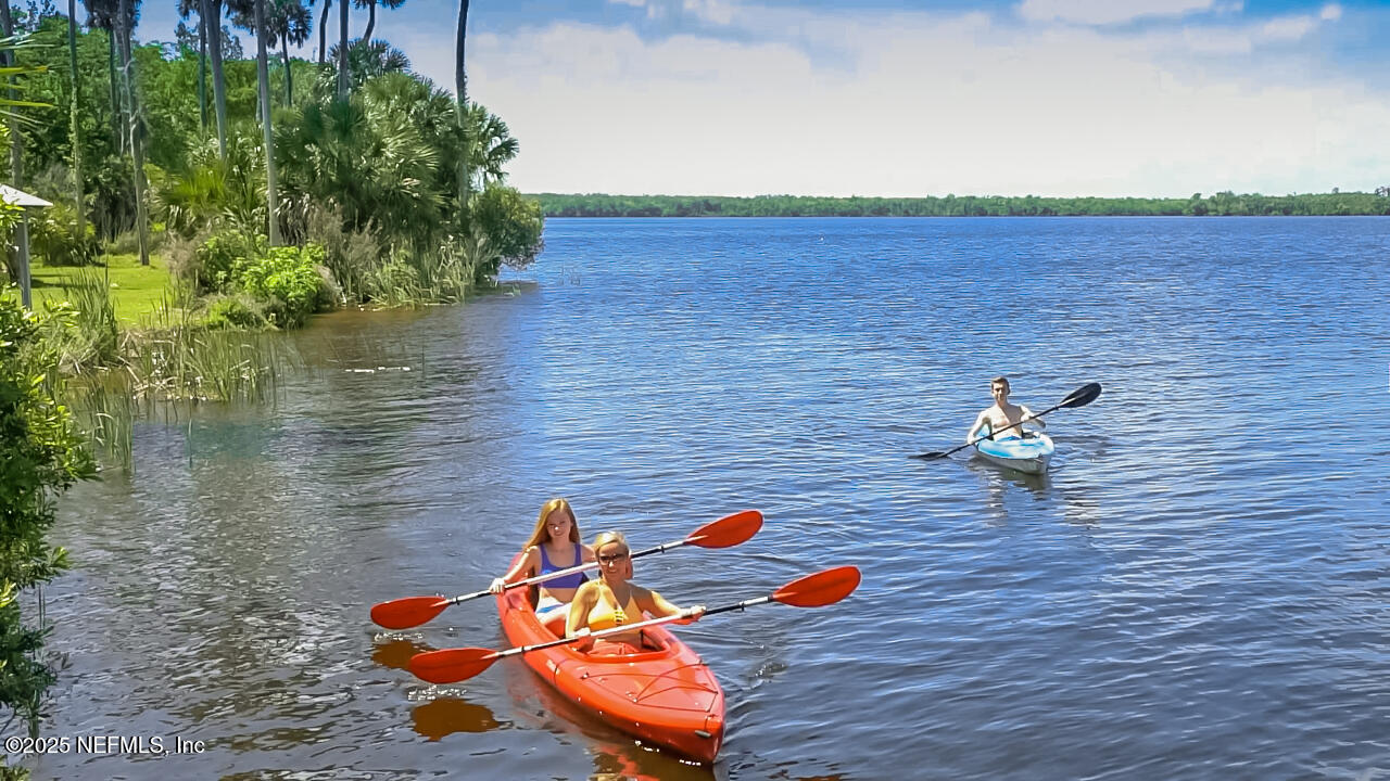 8280 A1A South St. Augustine, FL 32080 - Photo 4 of 4 a backyard of a house with seating space