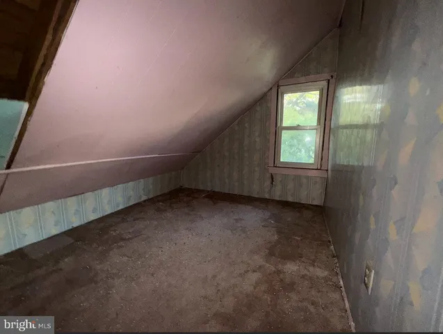 a view of a room with wooden walls