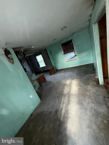 a view of an empty room with windows