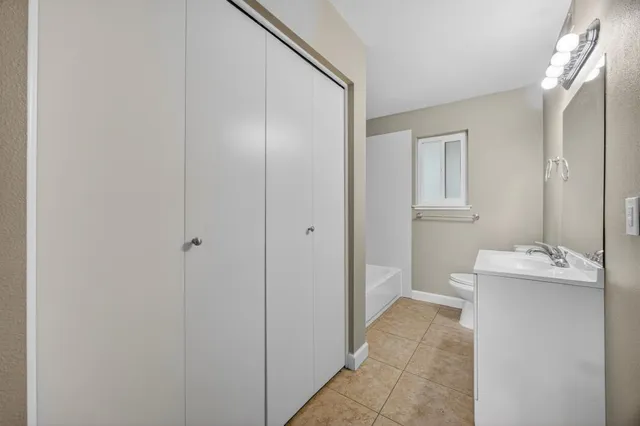 a bathroom with a sink double vanity and a mirror