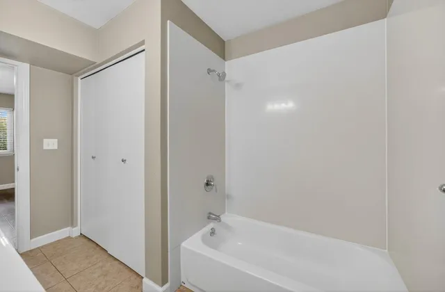 an aerial view of a house with outdoor space