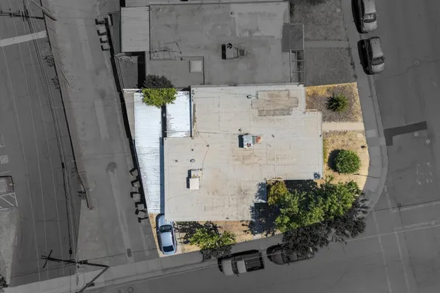 an aerial view of residential building and lake