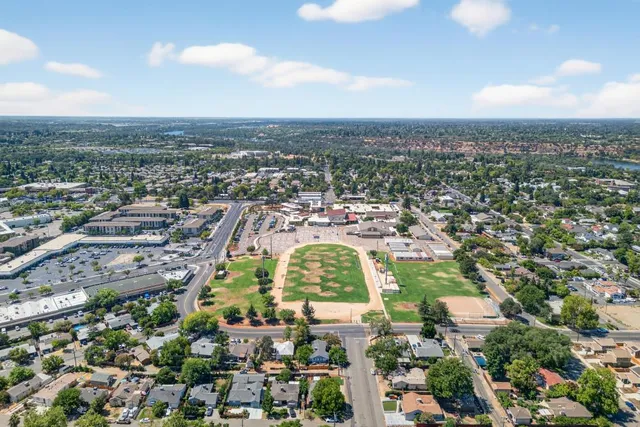 an aerial view of city and lake